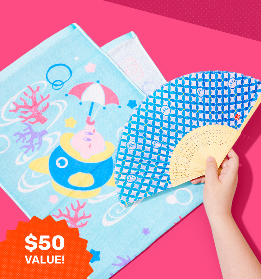Kirby fan and beach towel on a pink background