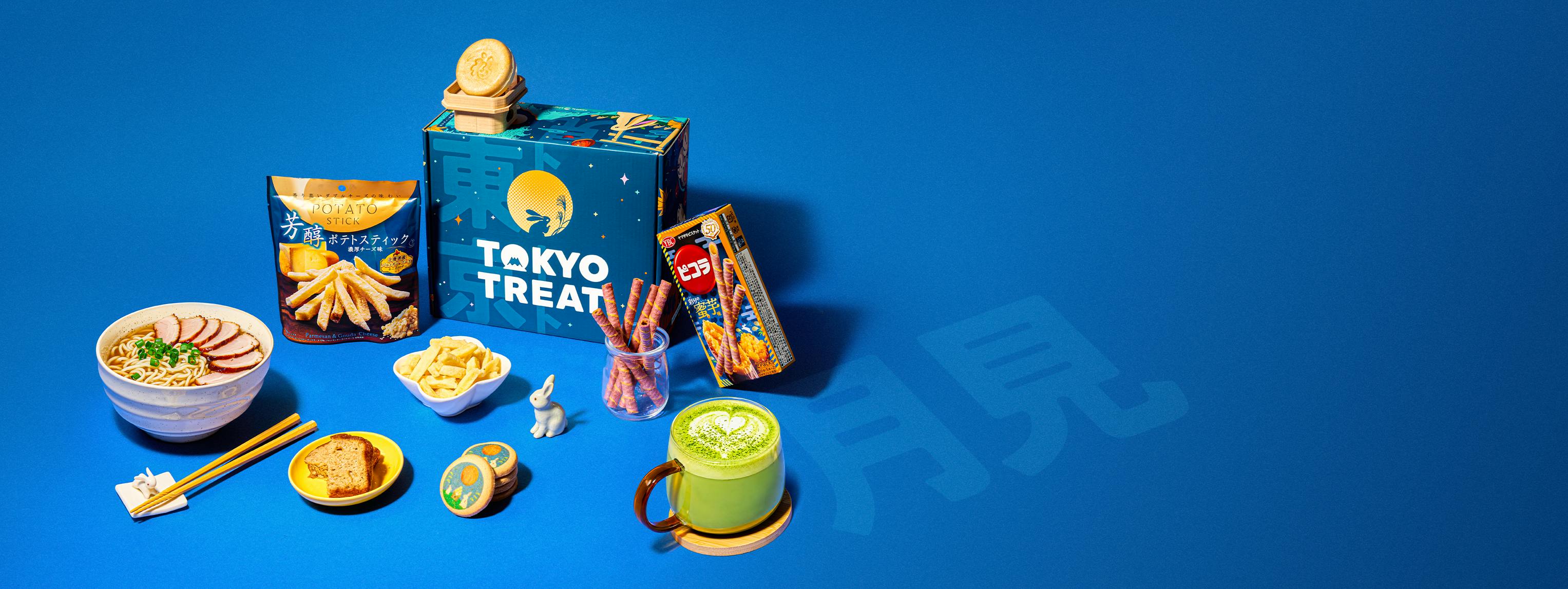 A blue box surrounded by Japanese snacks on a blue background