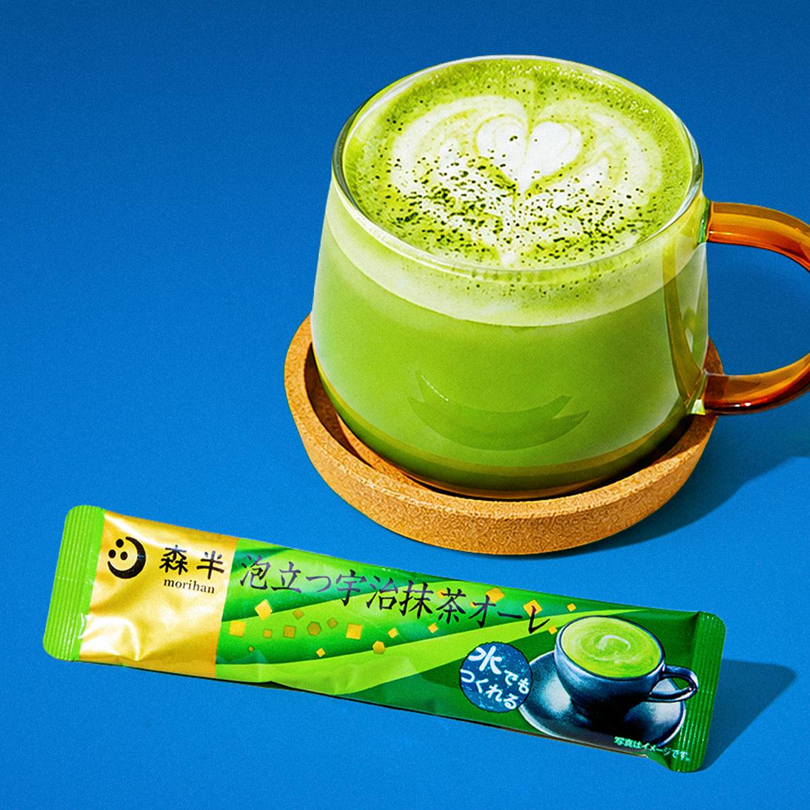 A matcha drink in a cup on a blue background